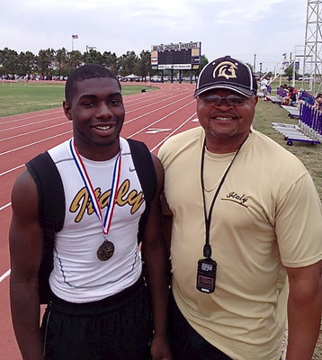 Image: Senior Gladiator TaMarcus Sheppard with his pops and coach, Bobby Campbell. Sheppard is state bound in the high jump event!