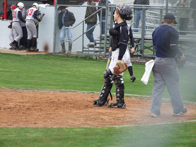 Image: Jackson watches carefully — Kyle Jackson, catcher for the Italy JV, makes sure the runners are out at first.