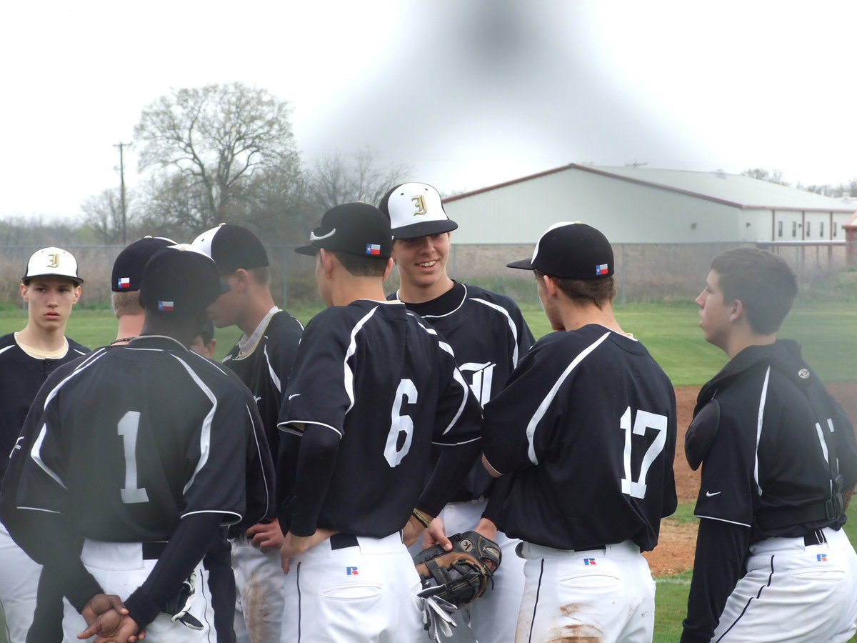 Image: Rally — The Gladiators rally around Coach Ward for last minute instructions.