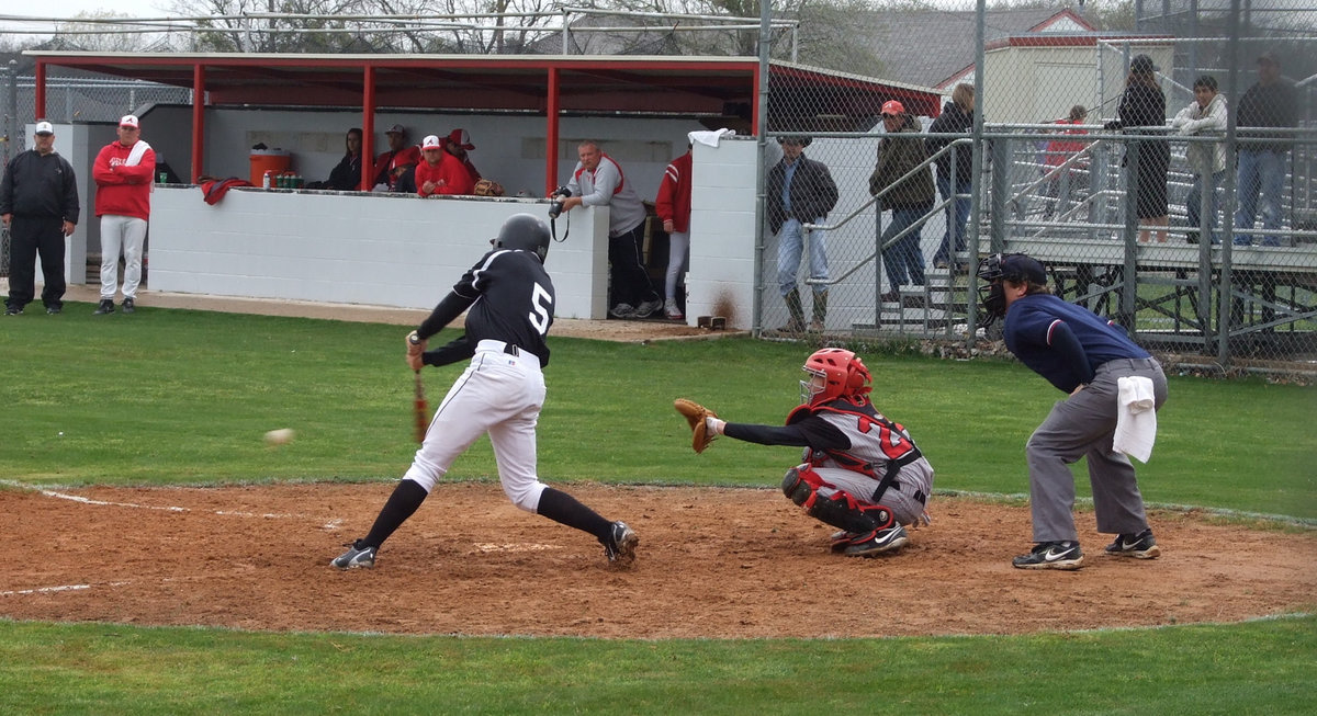 Image: It’s a hit — Kyle Jackson hits one up the first base line.