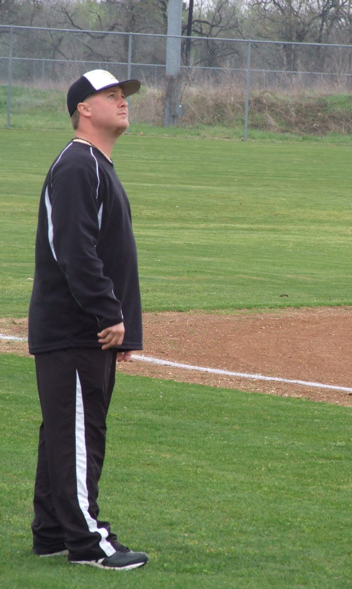 Image: That ball was fair! — Coach Ward watched his players in their first JV game of the season.