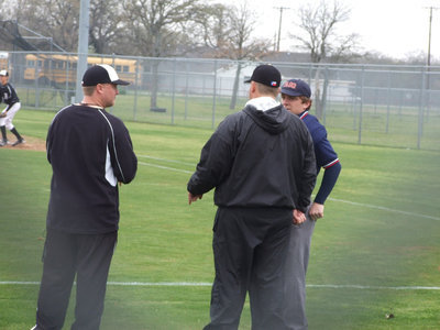 Image: A little discussion — Coaches Ward and Coker talk to “blue”.