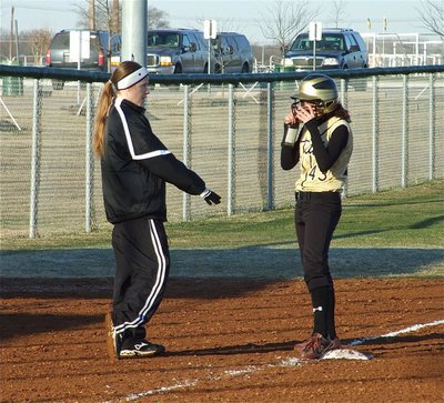 Image: Coach instructs Anna — Lady Gladiator Softball coach Jennifer Reeves instructs Anna Viers(43) at 3rd base.