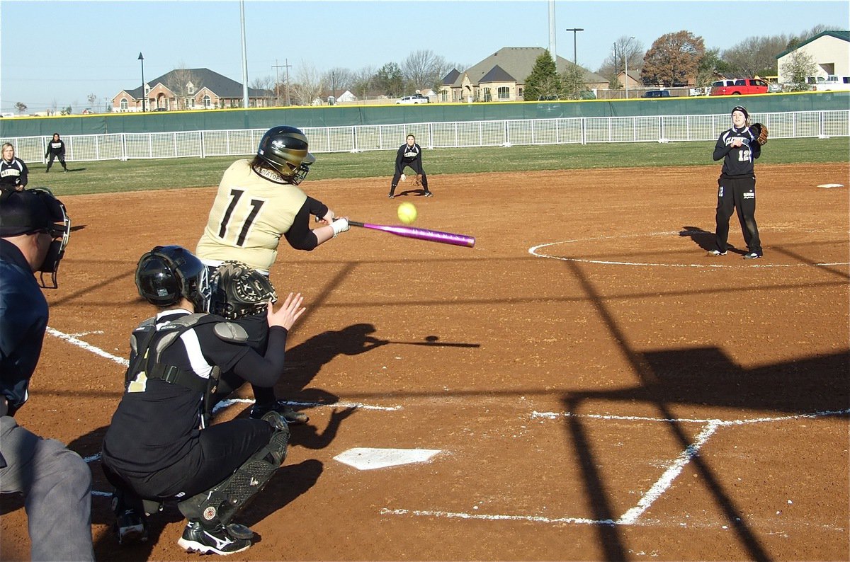 Image: Pest control — Lady Gladiator Meredith Brummett(11) swats the ball like it was a Yellowjacket.