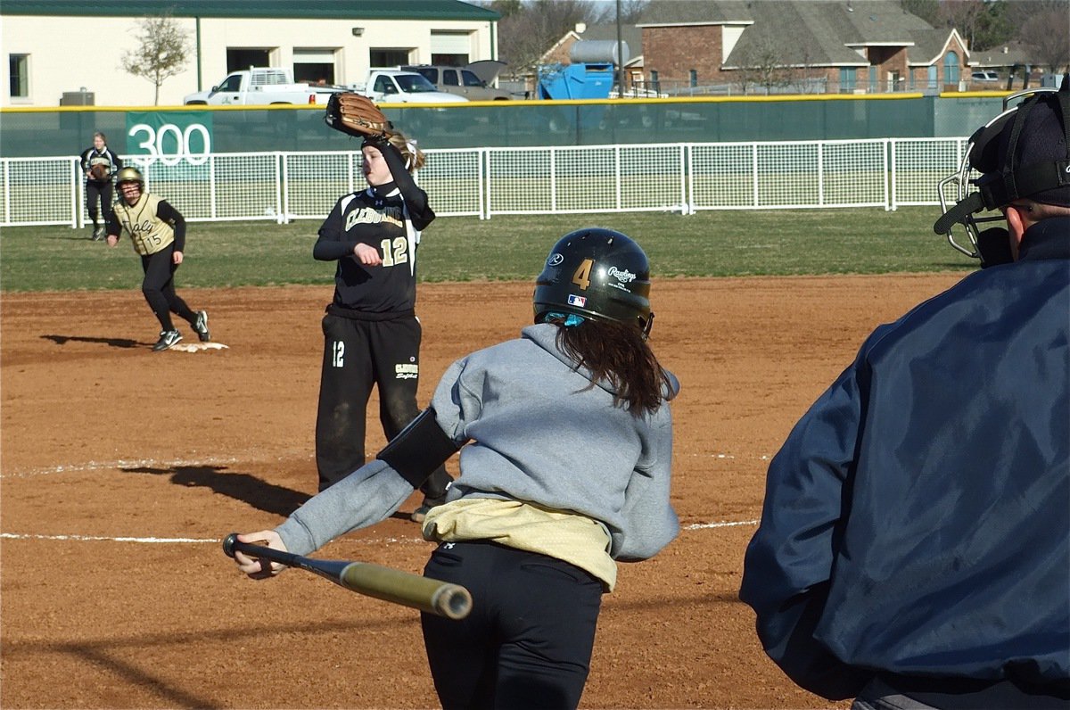 Image: Old reliable — Lady Gladiator senior Drew Windham(14) hits a shot toward 3rd base.