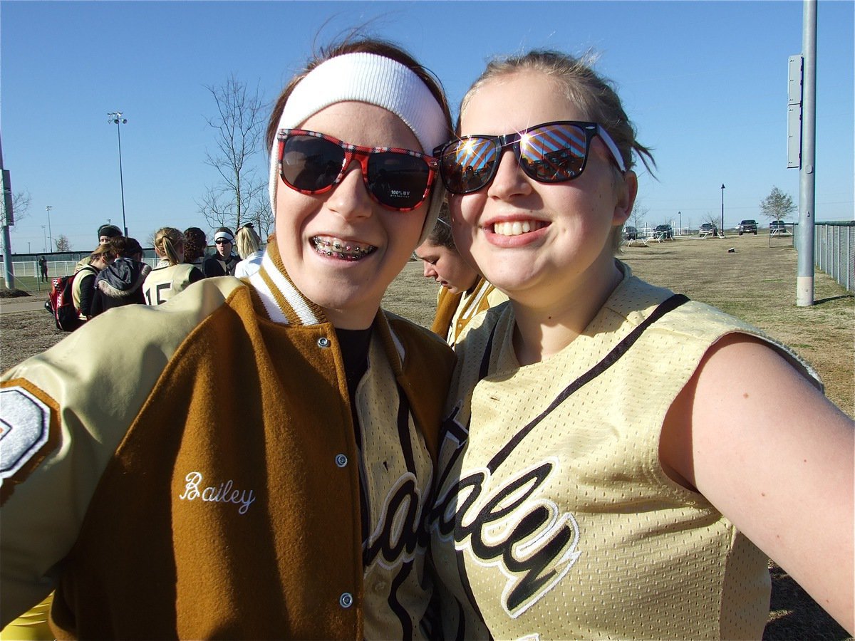 Image: Glamour and old gold — Bailey Bumpus and Julia McDaniel were all smiles after their spectacular win over 4A Cleburne.