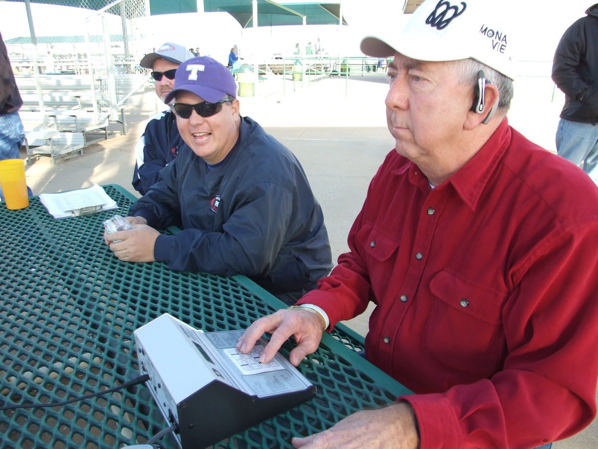 Image: On the clock — Mr. Westbrook works the game clock while providing comic relief for umpire Joe Windham and the guys.