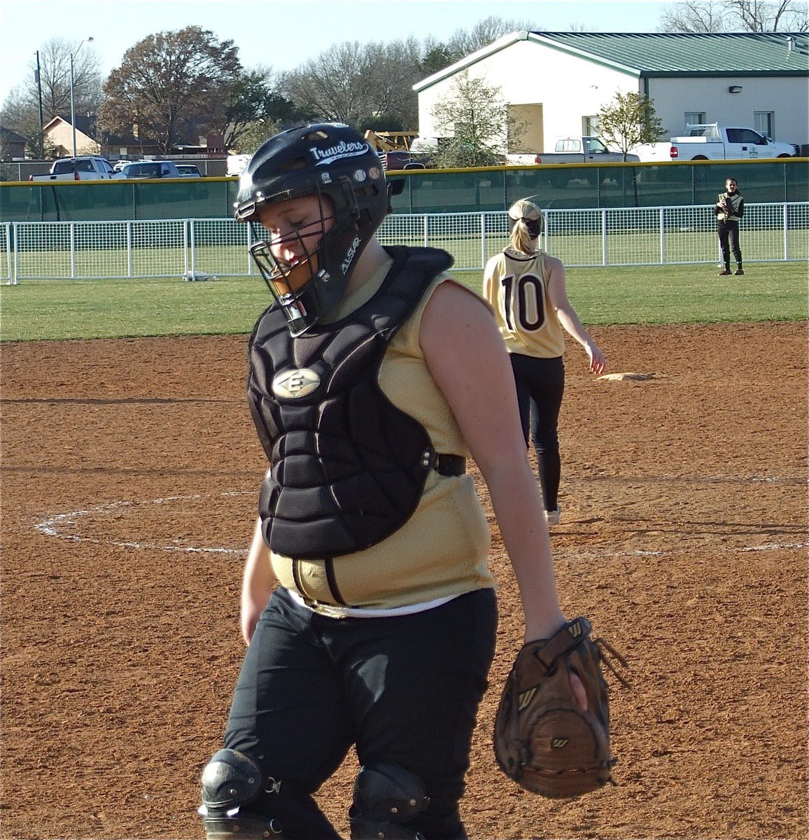 Image: Pitch and catch — Catcher Julia McDaniel returns after chatting with pitcher Courtney Westbrook.