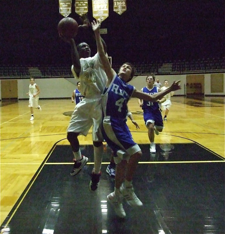 Image: Corrin makes it in — Italy’s Corrin Frazer(20) scores on the fast beak.