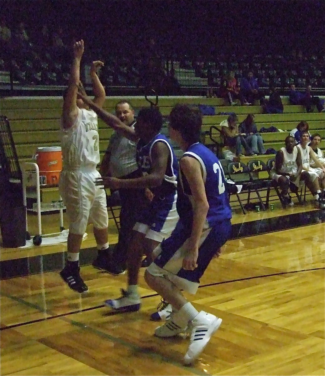 Image: Reid hits a three — Reid Jacinto(2) knocks down a 3-pointer under pressure.