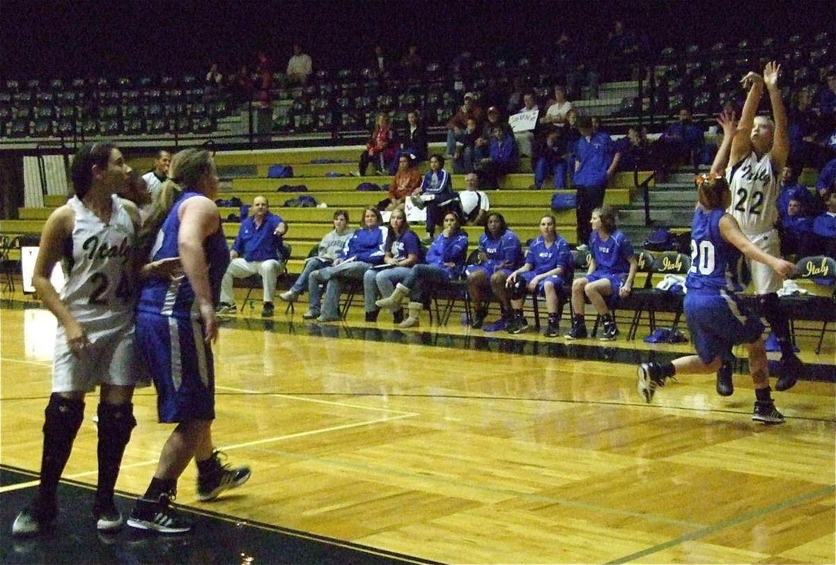 Image: Megan for three — Megan Richards(22) strokes a 3-pointer from the corner.