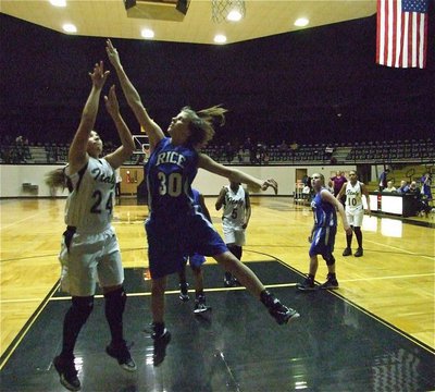 Image: Alyssa on the boards — Freshman Alyssa Richards(24) adds toughness and skill to Lady Gladiators.