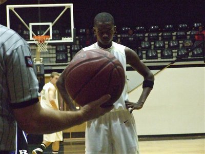 Image: Eyes on the ball — Aaron Thomas prepares to shoot a free shot against Rice.
