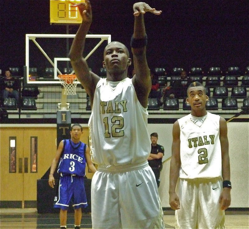 Image: Pencil it in — Aaron “Pencil” Thomas(12) causes Rita Garza to pencil in a another point in the scorebook.