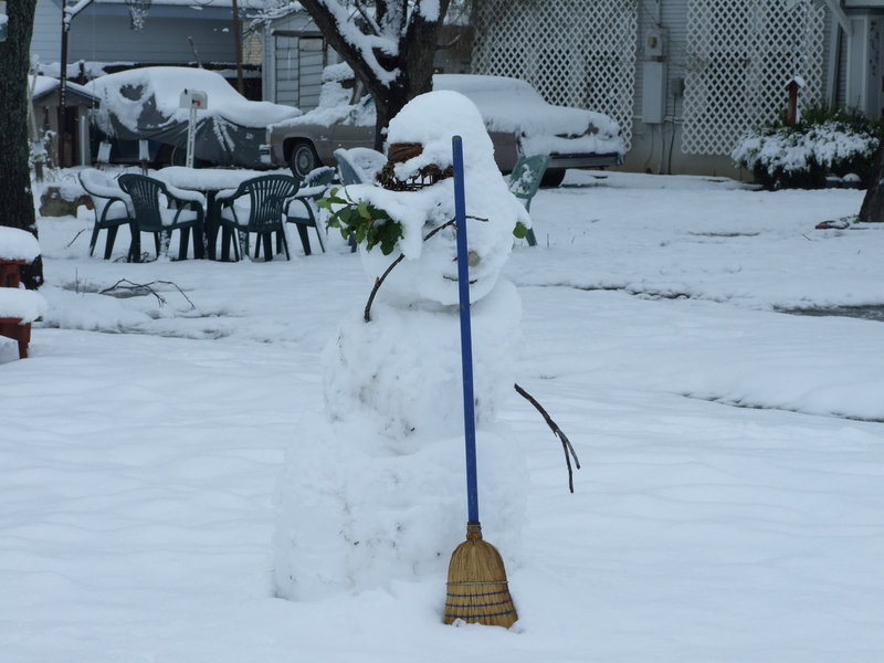 Image: Domestic Engineer Snowman — This hard working guy is ready to sweep snow off the sidewalks.