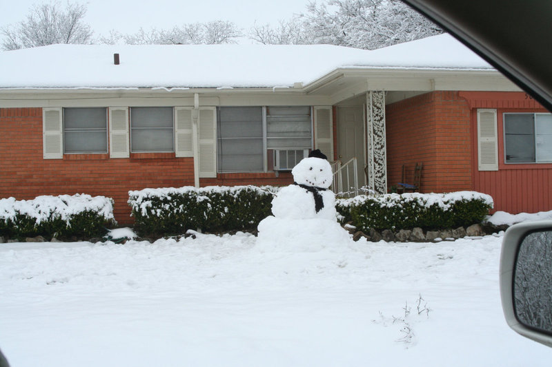 Image: He is happy to see you — This snowman is just waiting for you to come and play.