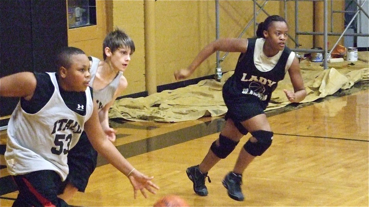 Image: On the move — Darol Mayberry(54) pushes the ball while Justin Wood and Brianna Burkhalter rush up the floor.