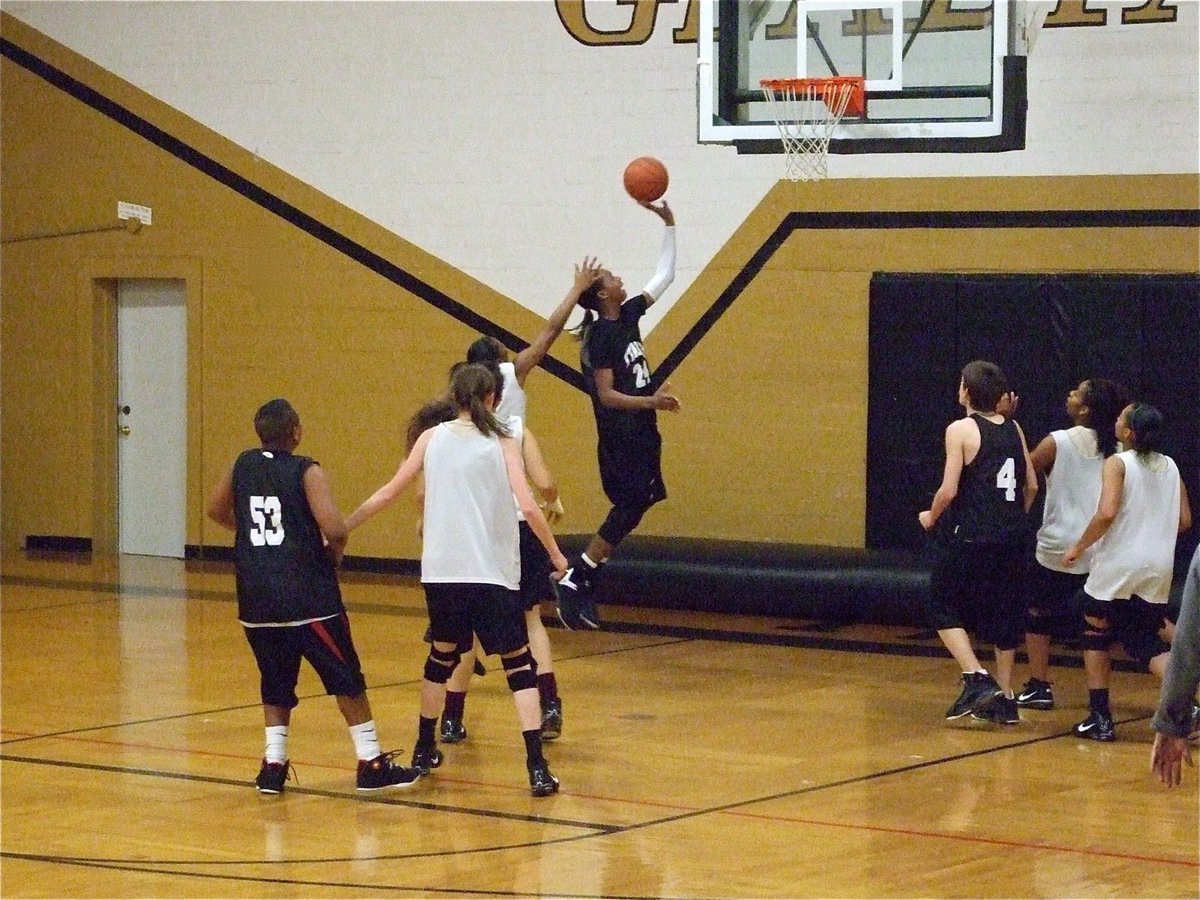 Image: Treyvon slips inside — Treyvon Robertson gets a shot up against the ladies in the lane.