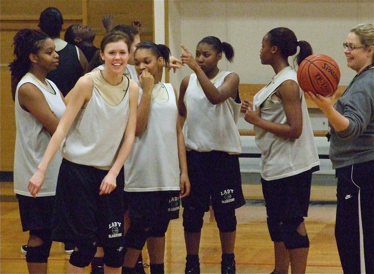 Image: Fun and game — Jaleecia Fleming, Kaitlyn Rossa, Alyssa Richards, Kyonne Birdsong, Chante Birdsong and Brianna Burkhalter give coach Stacy McDonald something to smile about.