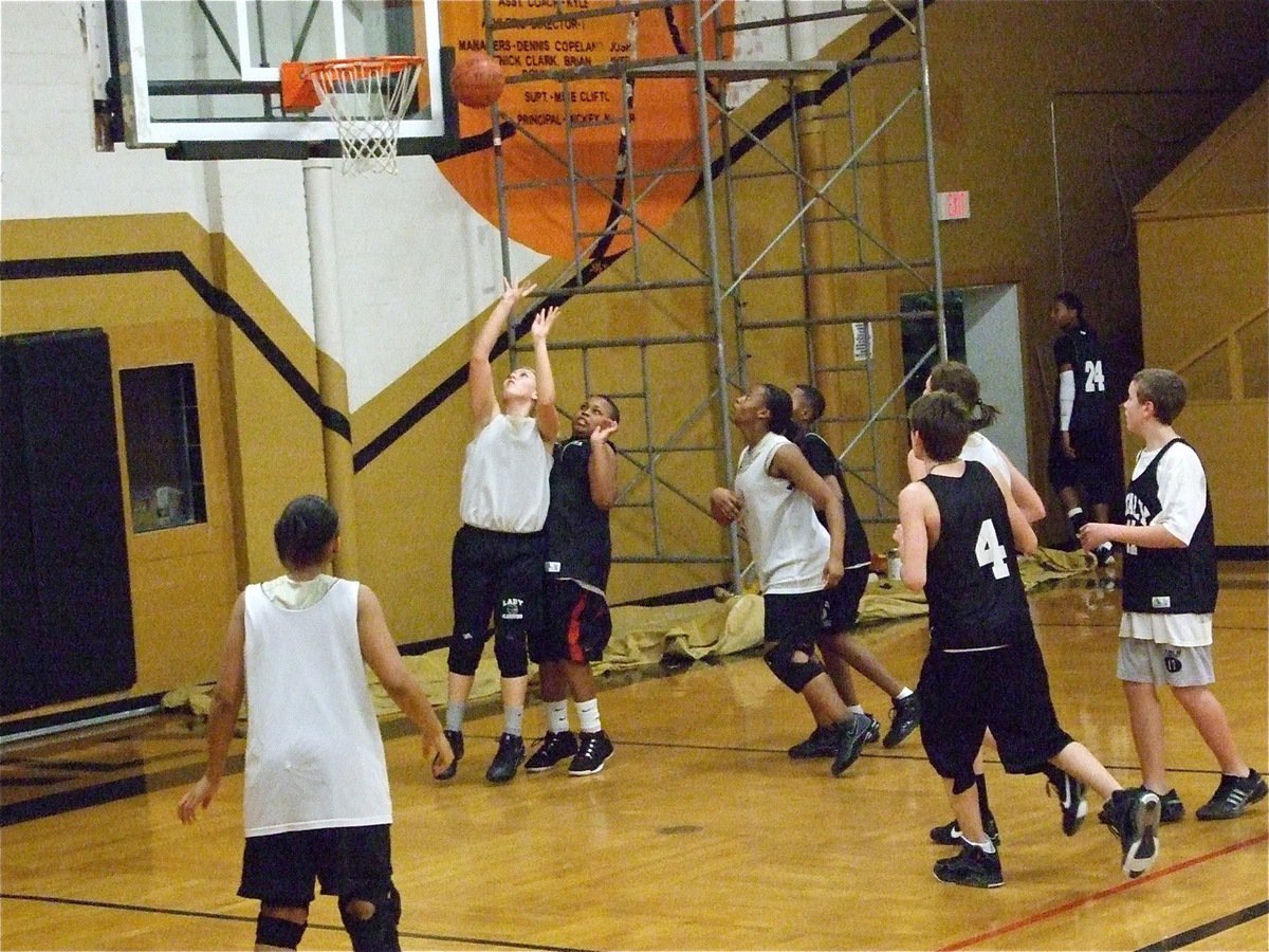 Image: Megan drives baseline — Megan Richards bullies her way into the lane for 2-points.