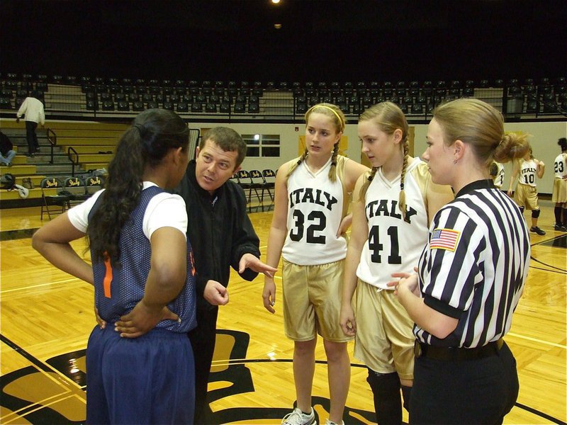 Image: Maddy and Jac — Madison Washington(32) and Jaclynn Lewis(41) represent their 7th grade squad as captains before the game.