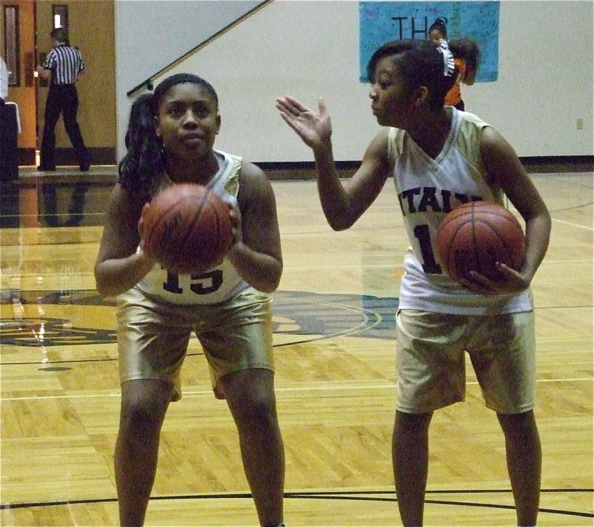 Image: Friendly advice — Ryisha Copeland tries to motivate Ashley Harper(15).