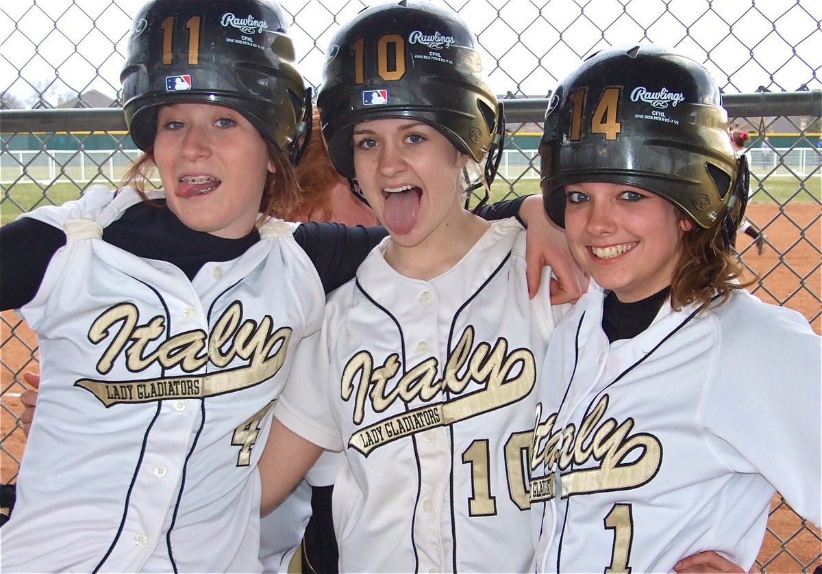 Image: With their rally helmets on, Italy went for their 7th win in a row — Bailey Bumpus, Courtney Westbrook and Morgan Cockerham try to create some comeback mojo against the Palmer Lady Bulldogs in the final game of a three day softball tournament at the Waxahachie Sports Complex.