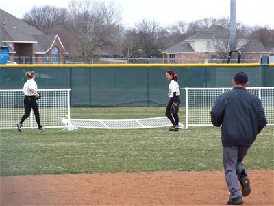 Image: I got it! I got it! Oops! — Center Fielder Anna Viers knocked over an innocent fence in an attempt to snag a homerun ball hit by Palmer.