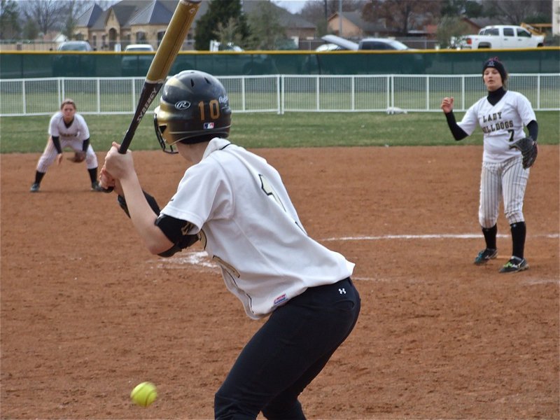 Image: Just a bit inside — Courtney Westbrook takes a ball low from the Palmer pitcher.