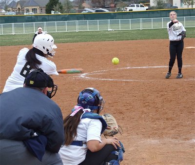 Image: Sister-to-sister — Pitcher Megan Richards tries to zip the ball into her sister, catcher Alyssa Richards.