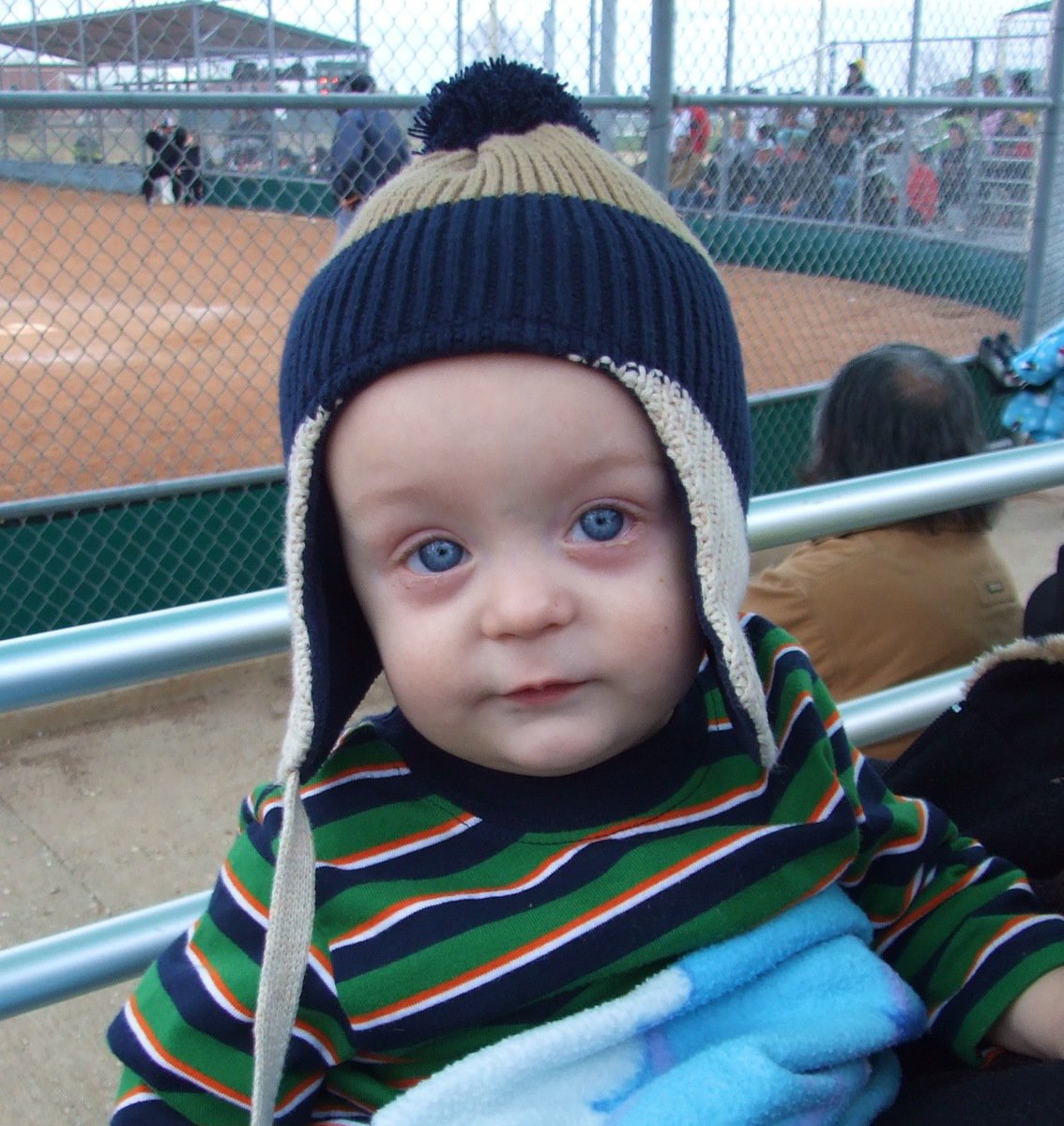 Image: Rally cap time! — The Lady Gladiators and Kace, their biggest little fan, put their rally hats on to inspire a comeback. Italy responded to the baby mojo and pulled in front 7-5.