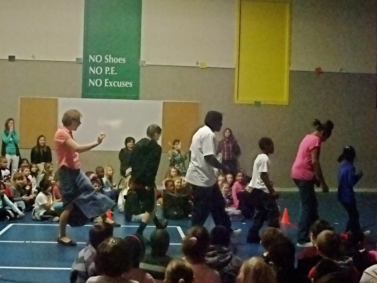 Image: They’re in the Groove — Mrs. Dorazil, Byron Thomas and students “getting down.”