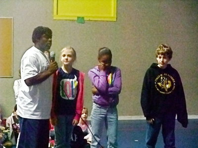 Image: Byron Thomas and Students — Annie Perry, Decorea Green and Michael Hughes were telling Byron what they wanted to be when they enter the working world. Annie wants to be a doctor, Decoria wants to be a basketball player and Michael Hughes want to be a basketball player or a baseball player.