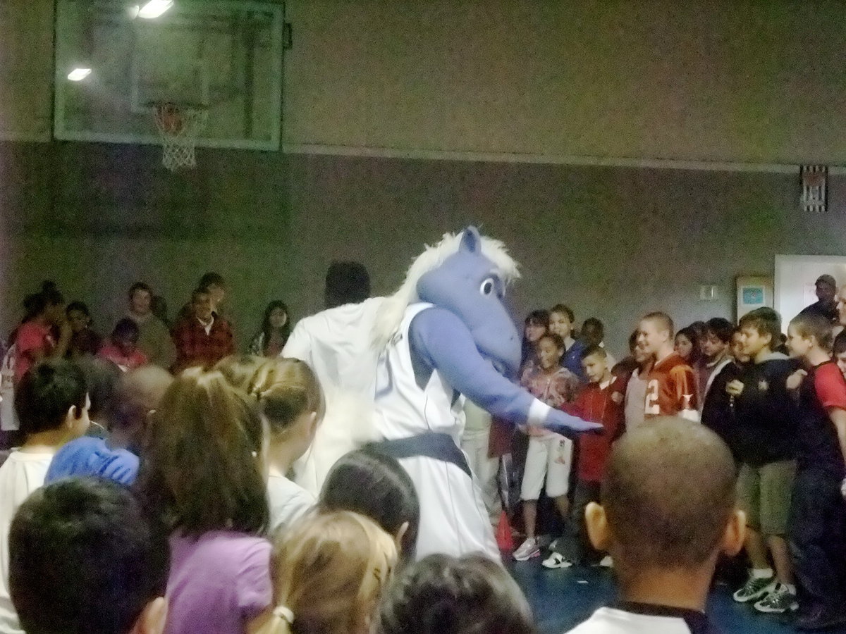 Image: Groovin’ with the Students — The students are doing the victory dance with Champ.