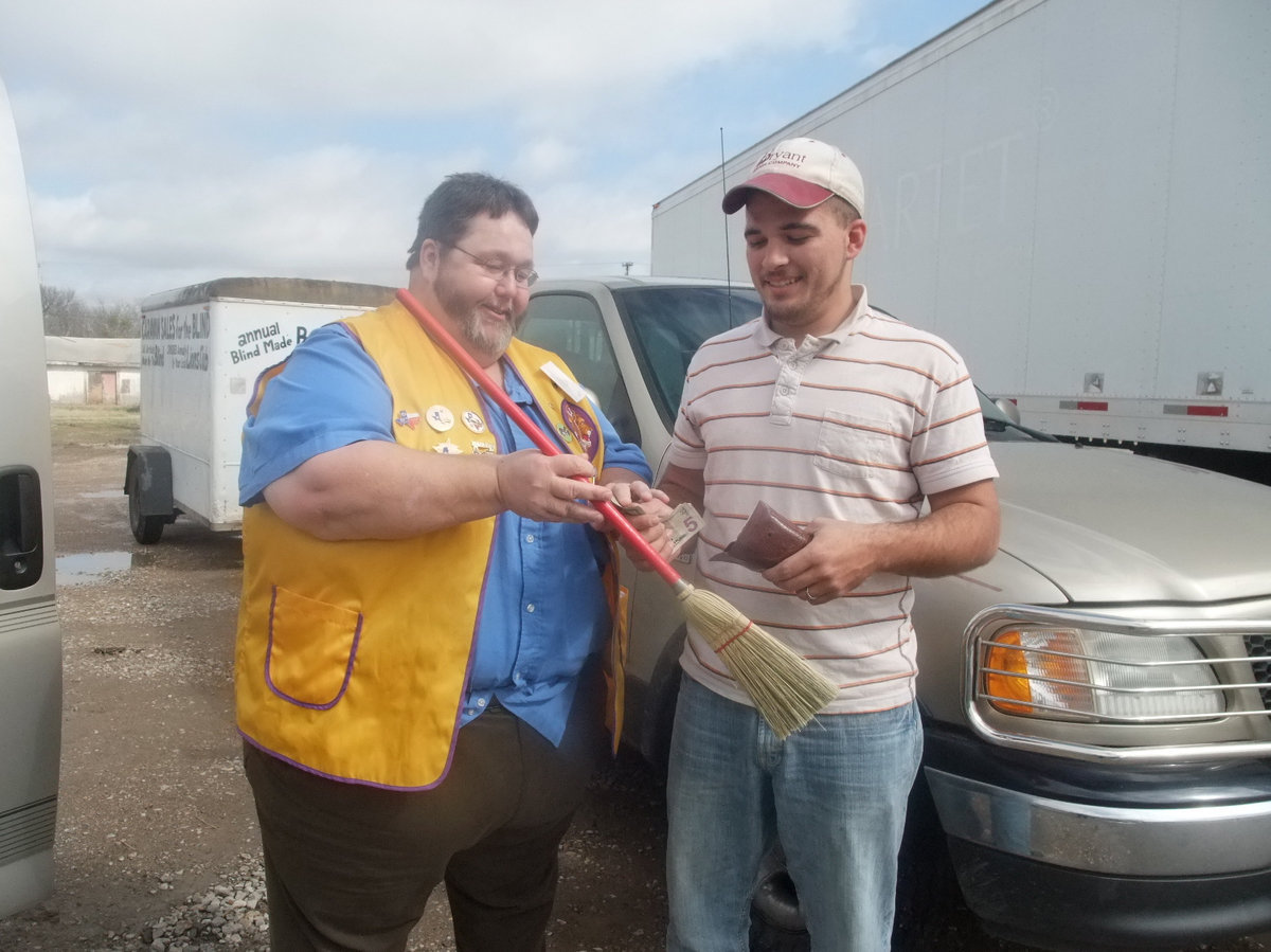 Image: Arvel Gowin and customer — Here is a happy customer supporting the blind.