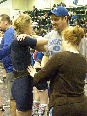 Image: Laura Harvey — Laura Harvey gets last minute coaching from Coach Crumpton as Coach Strange makes sure her belt is tight.