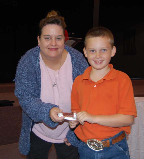 Image: Hunter Hinz — Past president Becky Hansen, left, presents Hunter Hinz of Italy with the ECEA Walk and Whoa Champion for 2009.