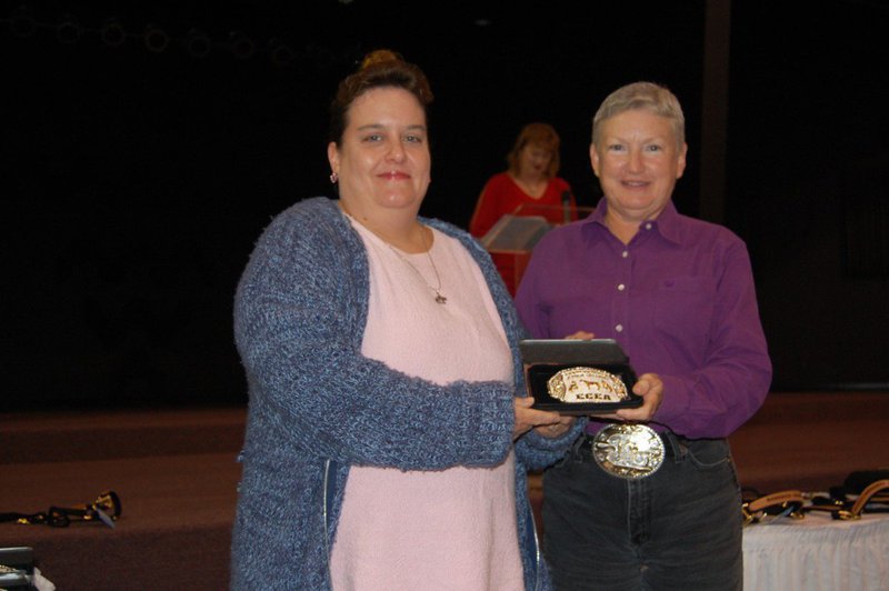 Image: Brenda Escamilla — Brenda Escamilla, right, won the buckle for showing her Champion Aged Mare at Halter.