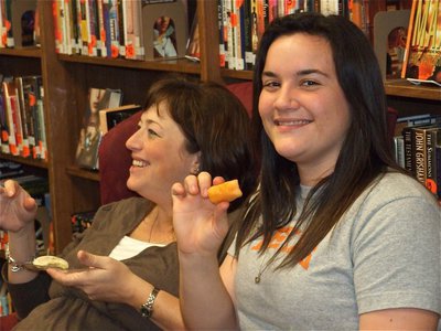 Image: Jenny and Kaytlyn — Jenny Bales and her oldest daughter Kaytlyn Bales share some fruit during the baby shower.