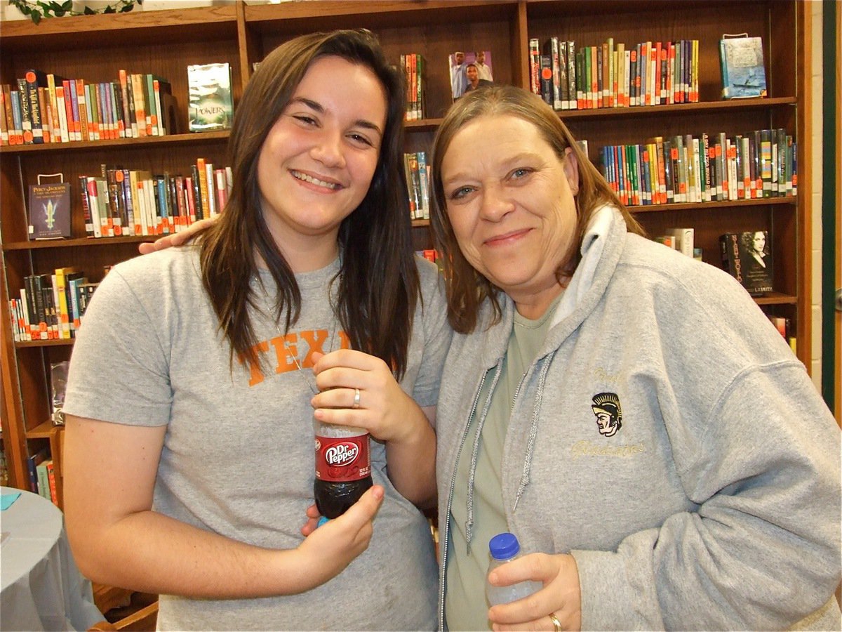 Image: Kaytlyn and Kristi — Kaytlyn Bales and Kristi Souder share a hug during the baby shower.