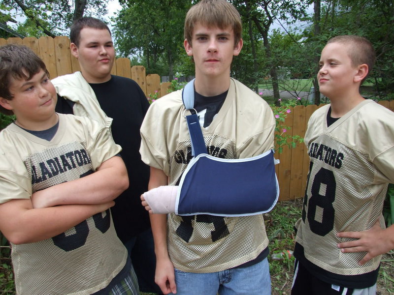Image: Justin Wood’s teammates won’t give him a break about his injury — Justin Wood is the kind of kid that would give his right arm to play Gladiator football, unfortunately, a break in his left arm will keep Justin out of the lineup during his 8th Grade season. Returning to school on Wednesday, Justin did get to spend time with teammates Zain Byers, Sampson Maldonado and Bailey Walton after practice.