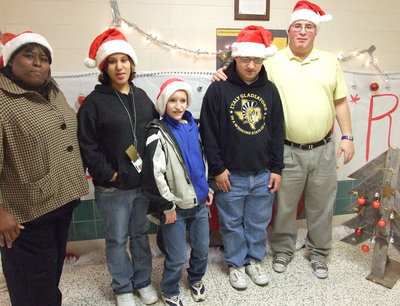 Image: The Winners! — Mrs. Davis, Morgan, Nathon, Blake and Mr. Destafani stand in “their” hallway.