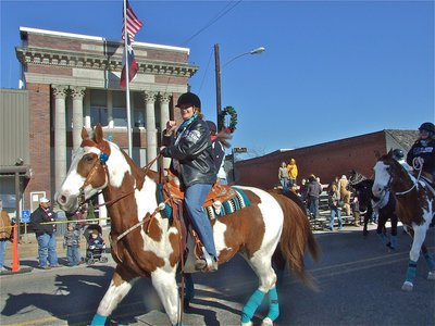 Image: Back in the saddle — Reminiscent of last years parade, beautiful horses lead the parade down Main Street in Italy.