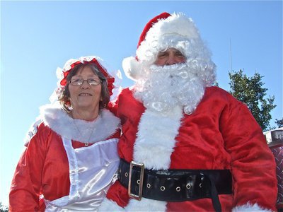 Image: Mrs. Claus and Santa — The Claus Family prepares to roll into downtown Italy to spread Holiday cheer to all.