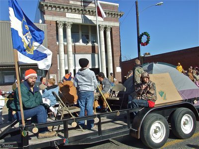 Image: Camped out — The Royal Ambassadors of the Central Baptist Church wave their flag proudly during the parade.