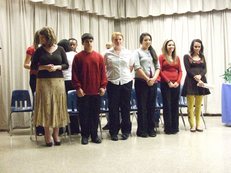 Image: Current NJHS members — Ms. Parker stands with the current members at the NJHS induction on Thursday night.
