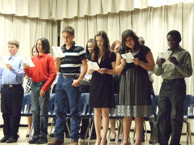 Image: The newbies — “I pledge to maintain high scholastic standing.  To hold as fundamental and worthy an untarnished character, to endeavor intelligently and courageously to be a leader, And to give of myself freely in service to others.  In so doing, I shall prove myself worthy of a place in the National Honor Society.”  The National Junior Honor Society Pledge