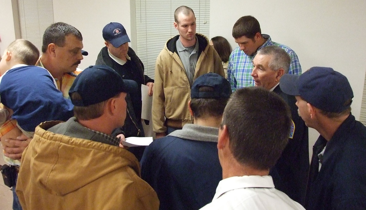 Image: The Last Huddle — Fire Chief Don Chamber gathers the Italy Fire Academy graduates around for some last minute instructions before the National Test on Thursday.