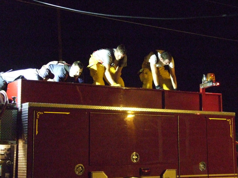 Image: Top of the engine — Loading the hose.