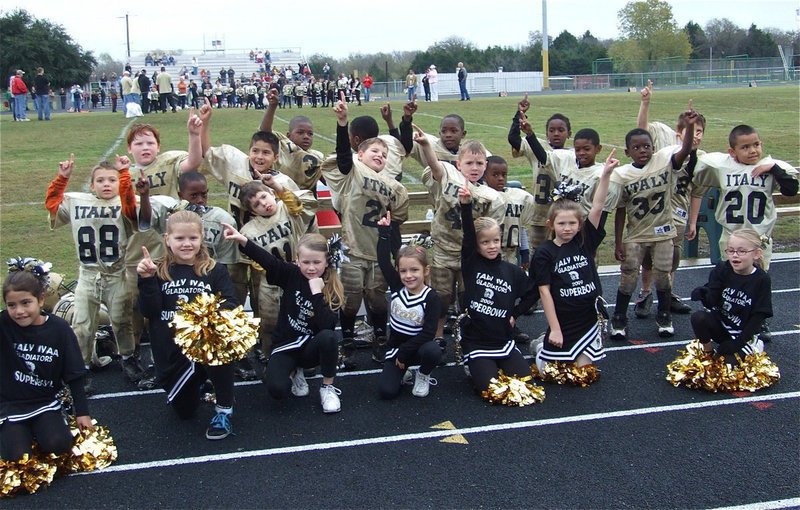 Image: IYAA C-Team Cheerleaders and players celebrate Suberbowl win — The IYAA C-Team Cheerleaders and players celebrate their Superbowl victory together.